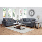 Divano blu con braccioli arrotondati e cuscini decorativi – 3 posti