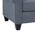 Divano blu con braccioli arrotondati e cuscini decorativi – 3 posti